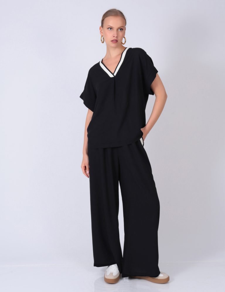 Black wide-leg pants with matching short-sleeve V-neck top – relaxed and stylish outfit for everyday comfort